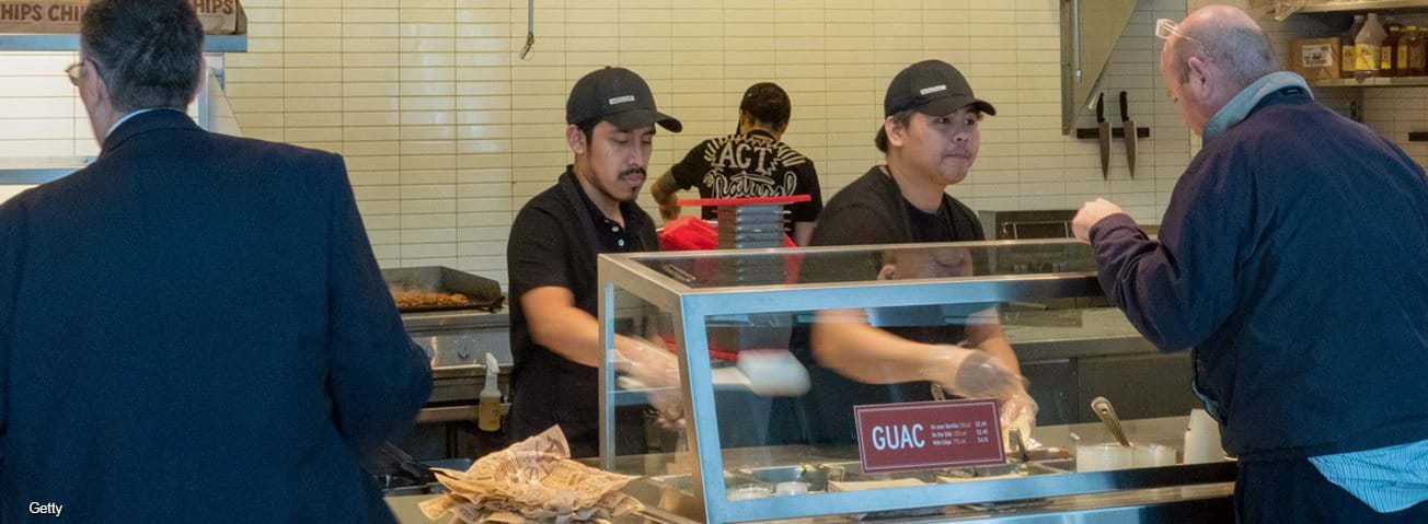 Customers being served at a quick-service restaurant