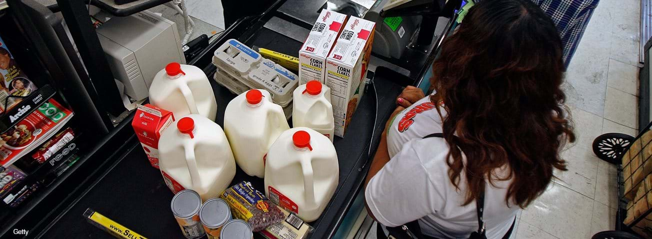 Women making WIC purchase at grocery checkout