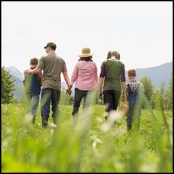 Farm family walking through field