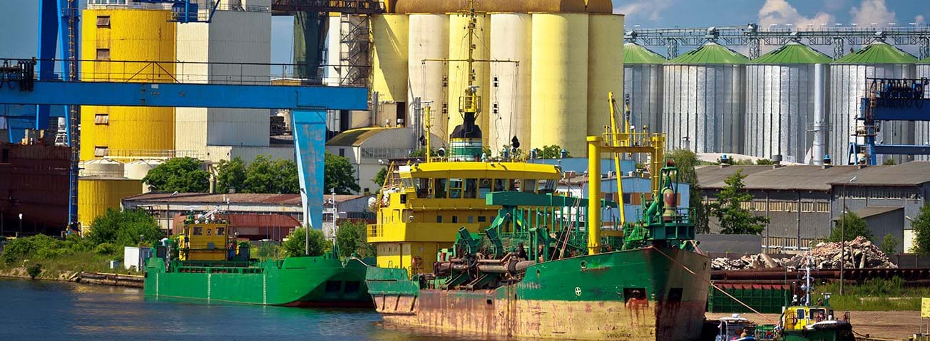 Boats near silos